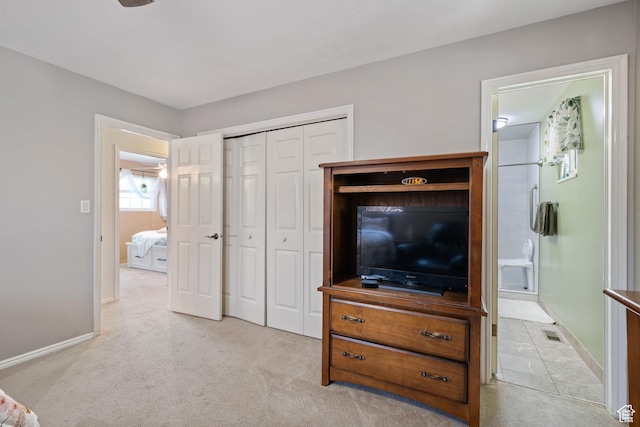 320 S 460 W, Hurricane, UT 84737 - bedroom with light colored carpet, a closet, and ensuite bath