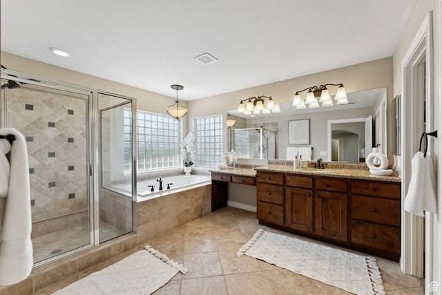 14318 S Butterfield Park Way, Herriman, UT 84096 - bathroom with vanity, a garden tub, a shower stall, and tile patterned flooring