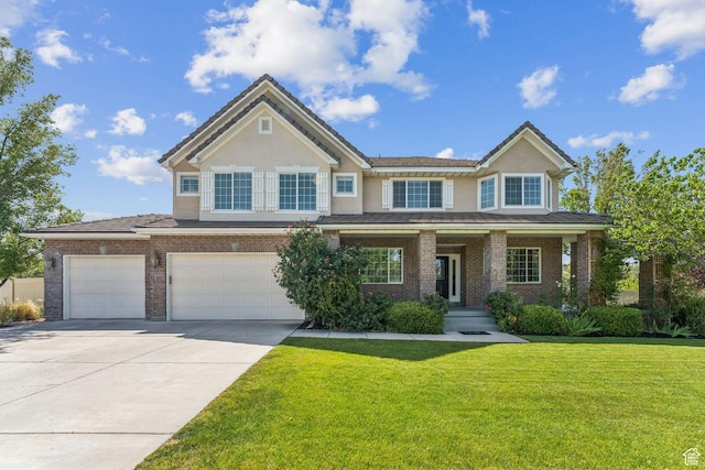14318 S Butterfield Park Way, Herriman, UT 84096 - view of front of house featuring concrete driveway, a front yard, stucco siding, and brick siding