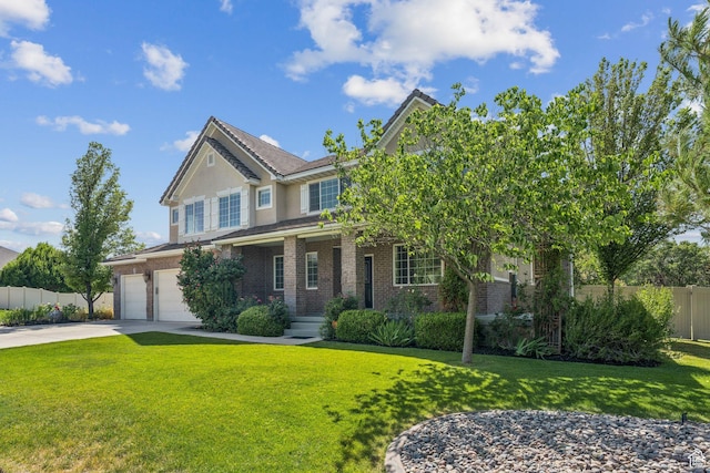 14318 S Butterfield Park Way, Herriman, UT 84096 - view of front of house with brick siding, an attached garage, driveway, stucco siding, and a porch