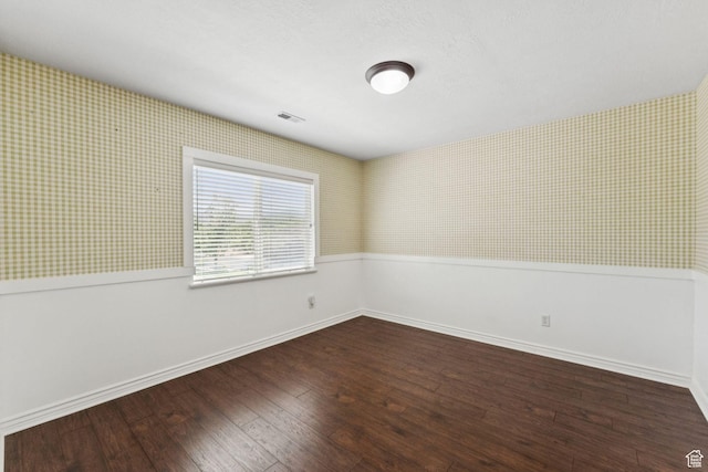 14318 S Butterfield Park Way, Herriman, UT 84096 - spare room featuring wallpapered walls, wood finished floors, and wainscoting