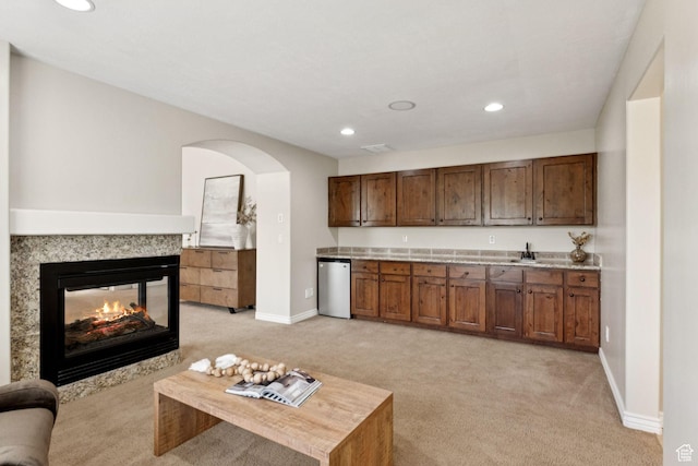 14318 S Butterfield Park Way, Herriman, UT 84096 - living room featuring light carpet, arched walkways, recessed lighting, and a multi sided fireplace