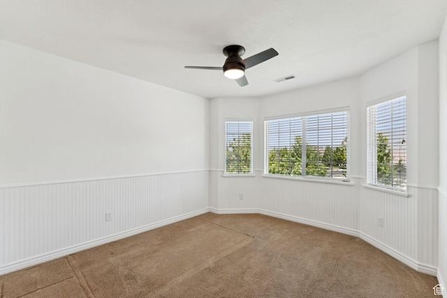 14318 S Butterfield Park Way, Herriman, UT 84096 - unfurnished room featuring carpet, ceiling fan, and a wainscoted wall