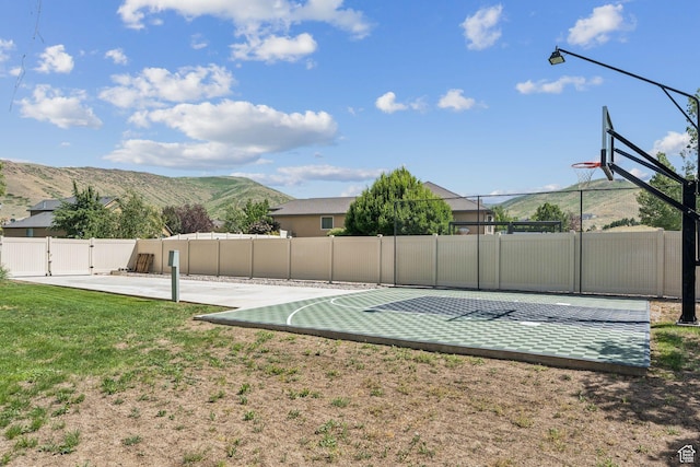 14318 S Butterfield Park Way, Herriman, UT 84096 - view of sport court with community basketball court, a mountain view, and a gate