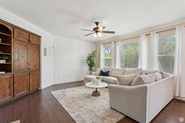 14318 S Butterfield Park Way, Herriman, UT 84096 - living area with a decorative wall, healthy amount of natural light, ceiling fan, and dark wood-style flooring