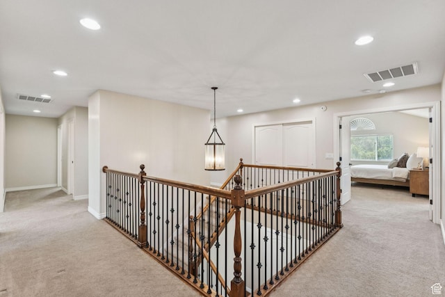 14318 S Butterfield Park Way, Herriman, UT 84096 - hallway with carpet floors, recessed lighting, and an upstairs landing