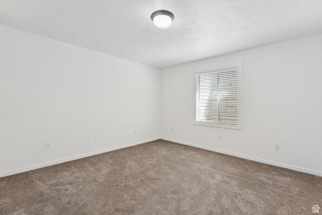 14318 S Butterfield Park Way, Herriman, UT 84096 - carpeted spare room with baseboards