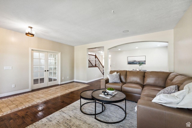 14318 S Butterfield Park Way, Herriman, UT 84096 - living area featuring arched walkways, hardwood / wood-style floors, stairs, french doors, and recessed lighting