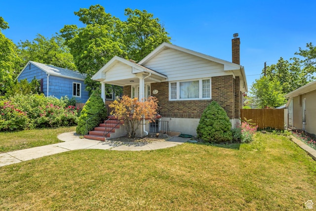 1252 E Bryan Ave S, Salt Lake City, UT 84105 - bungalow featuring a chimney, brick siding, and a porch