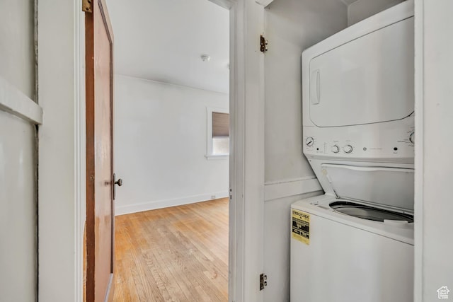 1252 E Bryan Ave S, Salt Lake City, UT 84105 - laundry area with stacked washing machine and dryer and hardwood / wood-style floors