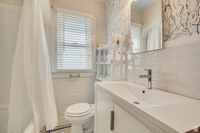 1252 E Bryan Ave S, Salt Lake City, UT 84105 - bathroom with tile walls, vanity, and shower / bath combination with curtain