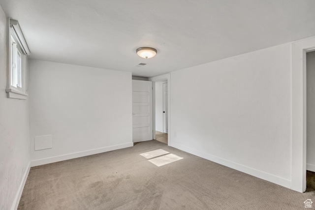 1252 E Bryan Ave S, Salt Lake City, UT 84105 - spare room featuring carpet flooring and baseboards