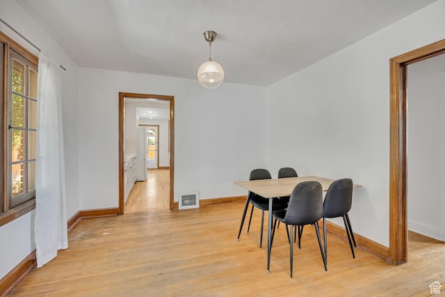 1252 E Bryan Ave S, Salt Lake City, UT 84105 - dining space featuring light wood-type flooring and baseboards
