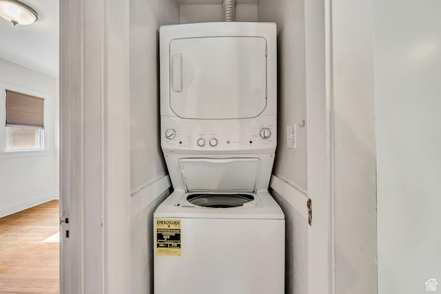 1252 E Bryan Ave S, Salt Lake City, UT 84105 - washroom with stacked washer / drying machine and wood finished floors