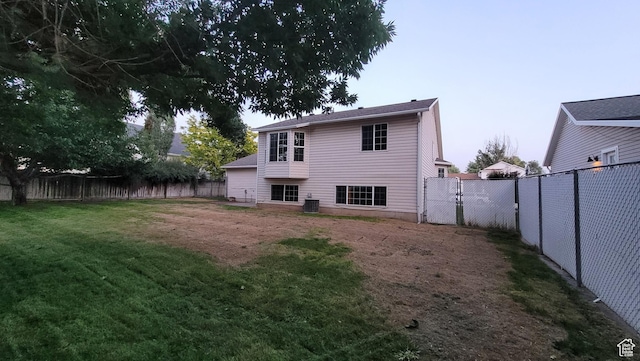 2826 W 4275 S, Roy, UT 84067 - back of house featuring a fenced backyard and a gate