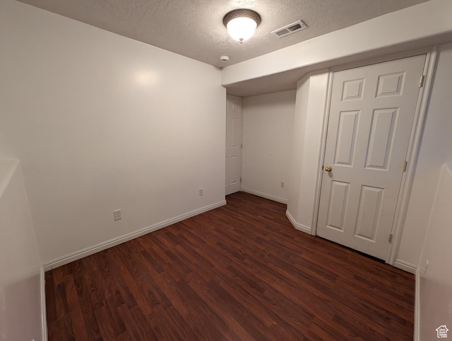 2826 W 4275 S, Roy, UT 84067 - unfurnished bedroom with dark wood-style floors and a textured ceiling