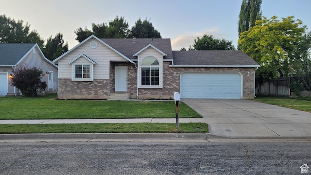 2826 W 4275 S, Roy, UT 84067 - single story home featuring an attached garage, brick siding, concrete driveway, and roof with shingles