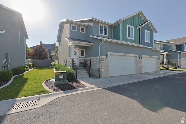 8151 St Cecilia St S, Eagle Mountain, UT 84005 - view of front of house featuring stone siding, an attached garage, stucco siding, board and batten siding, and a residential view