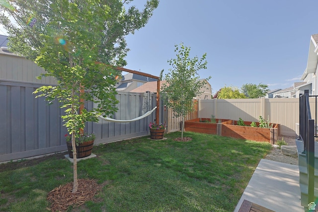 8151 St Cecilia St S, Eagle Mountain, UT 84005 - fenced backyard with a vegetable garden