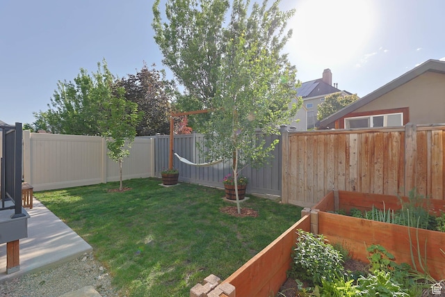 8151 St Cecilia St S, Eagle Mountain, UT 84005 - fenced backyard featuring a vegetable garden