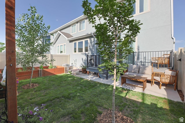 8151 St Cecilia St S, Eagle Mountain, UT 84005 - back of property with a fenced backyard, an outdoor living space, stucco siding, and a patio