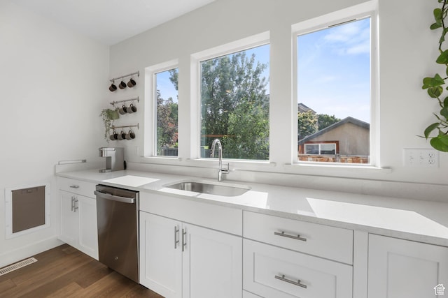 8151 St Cecilia St S, Eagle Mountain, UT 84005 - kitchen featuring stainless steel dishwasher, white cabinets, and dark wood-style flooring