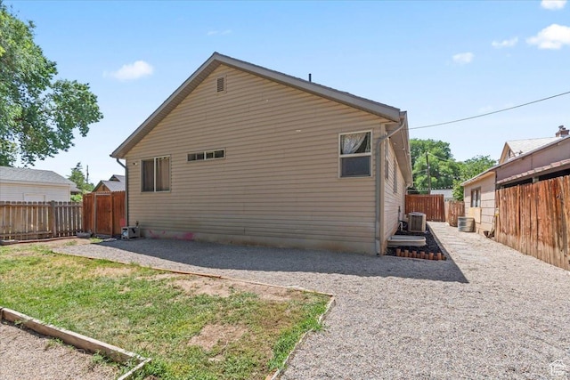 1544 Liberty Ave, Ogden, UT 84404 - view of side of home featuring a fenced backyard and a patio