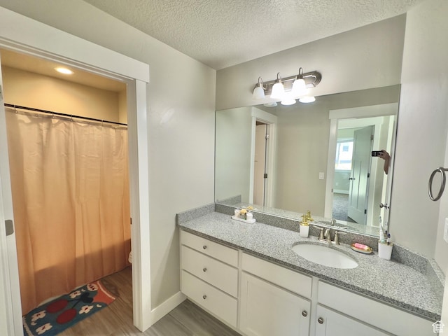 6057 W Herriman View Way, Herriman, UT 84096 - bathroom featuring wood finished floors, vanity, a textured ceiling, and curtained shower