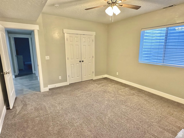 6057 W Herriman View Way, Herriman, UT 84096 - unfurnished bedroom with a textured ceiling, carpet, a closet, and a ceiling fan