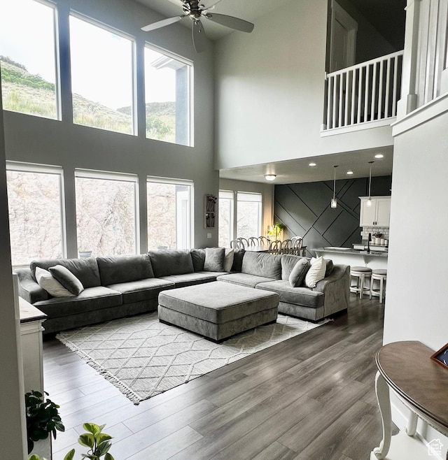 6057 W Herriman View Way, Herriman, UT 84096 - living room with ceiling fan, a towering ceiling, plenty of natural light, and wood finished floors