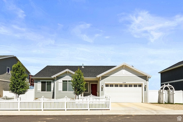 1268 S Raintree Ln, Santaquin, UT 84655 - single story home featuring an attached garage, concrete driveway, a fenced front yard, and a shingled roof