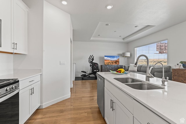 1268 S Raintree Ln, Santaquin, UT 84655 - kitchen with range, light wood-style flooring, dishwasher, light countertops, and recessed lighting