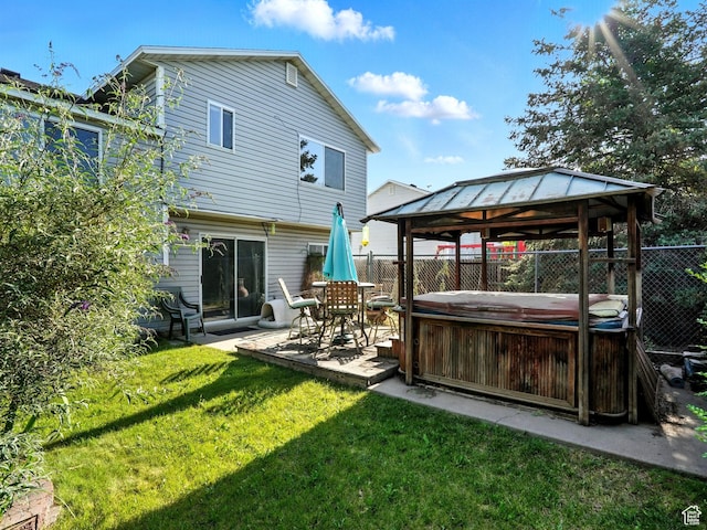 1213 W 1640 N, Clinton, UT 84015 - rear view of property featuring a hot tub, a gazebo, and a patio area