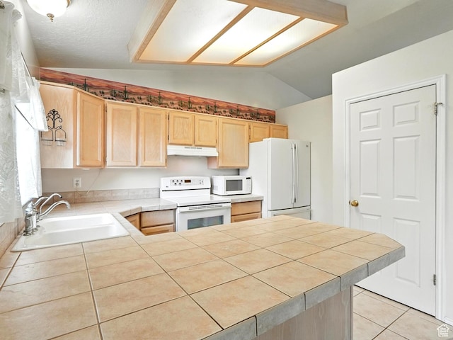1213 W 1640 N, Clinton, UT 84015 - kitchen featuring white appliances, under cabinet range hood, light brown cabinetry, lofted ceiling, and a peninsula