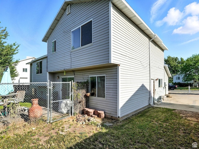 1213 W 1640 N, Clinton, UT 84015 - rear view of house with a gate
