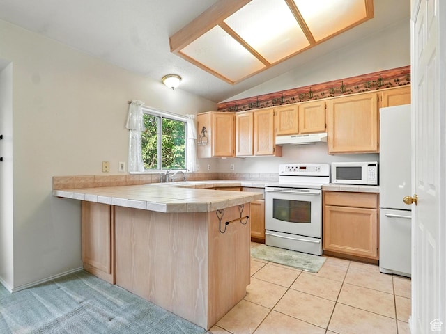 1213 W 1640 N, Clinton, UT 84015 - kitchen featuring white appliances, under cabinet range hood, light brown cabinetry, vaulted ceiling, and tile counters