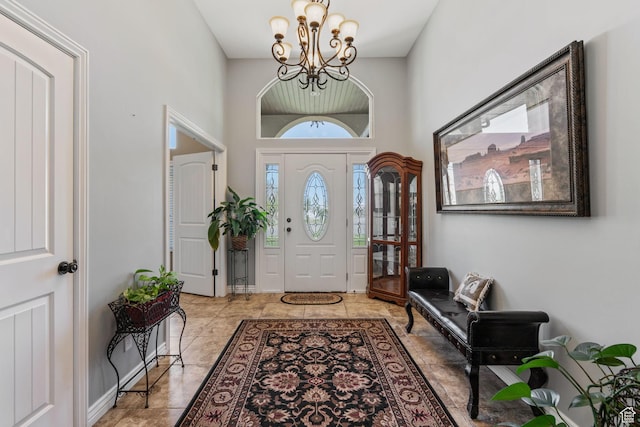6613 W 200 N, Ogden, UT 84404 - entryway featuring a chandelier, a high ceiling, and tile patterned floors