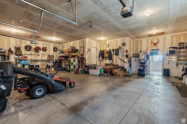 6613 W 200 N, Ogden, UT 84404 - garage with a garage door opener and a workshop area