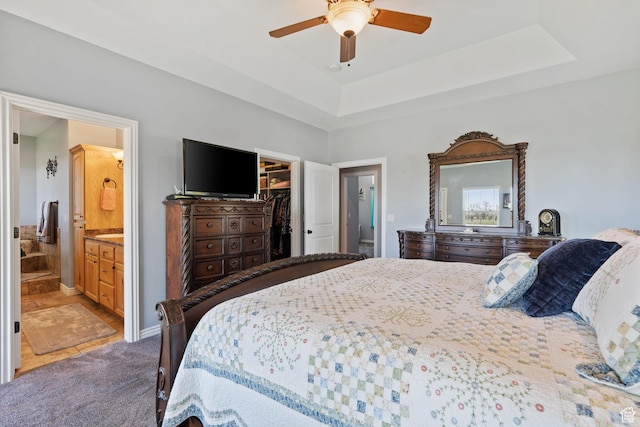 6613 W 200 N, Ogden, UT 84404 - carpeted bedroom featuring a spacious closet, a raised ceiling, ensuite bath, a closet, and ceiling fan
