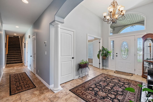 6613 W 200 N, Ogden, UT 84404 - entryway featuring stairs, ornate columns, a chandelier, recessed lighting, and light tile patterned floors