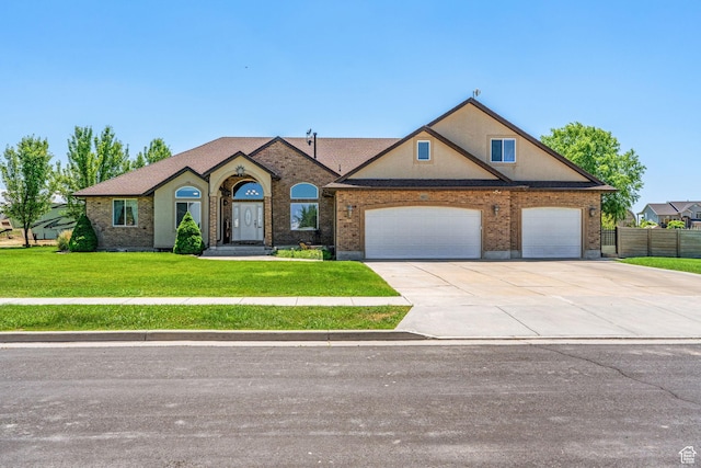 6613 W 200 N, Ogden, UT 84404 - view of front facade with concrete driveway, a garage, and brick siding
