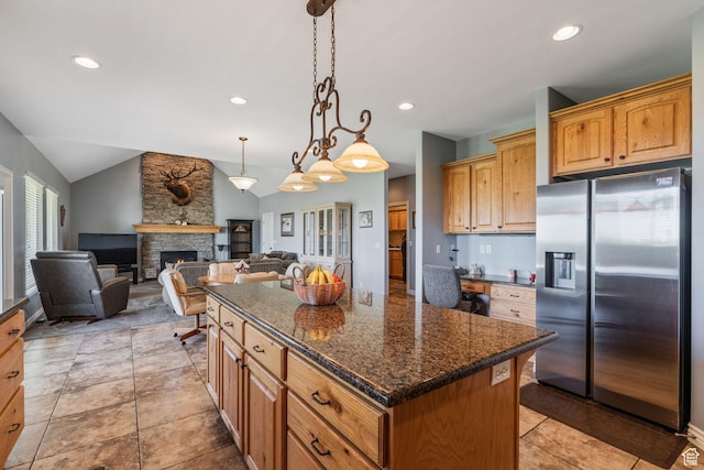 6613 W 200 N, Ogden, UT 84404 - kitchen featuring stainless steel fridge with ice dispenser, lofted ceiling, a center island, a fireplace, and decorative light fixtures