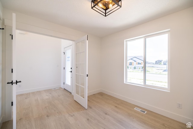 361 E Ventura Blvd, Tooele, UT 84074 - empty room featuring light wood-type flooring and french doors