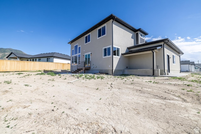 361 E Ventura Blvd, Tooele, UT 84074 - rear view of house with stucco siding