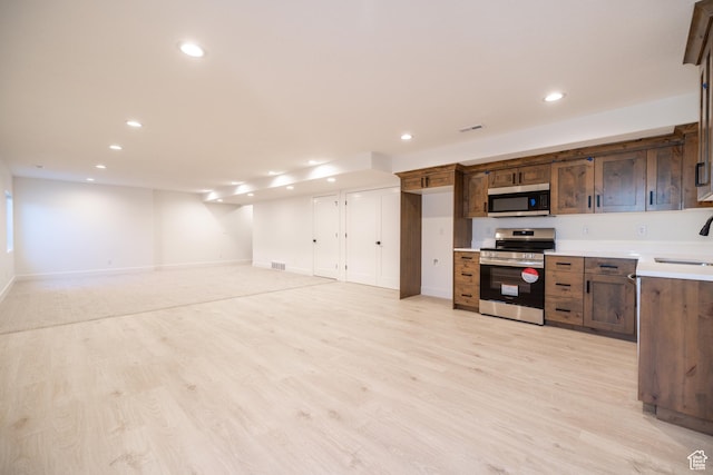 361 E Ventura Blvd, Tooele, UT 84074 - kitchen featuring stainless steel appliances, light countertops, recessed lighting, and light wood-style flooring