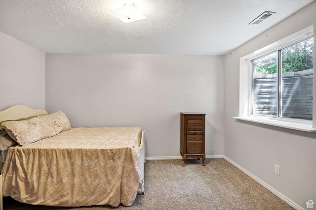 345 E 2475 N, North Logan, UT 84341 - bedroom featuring a textured ceiling and carpet flooring