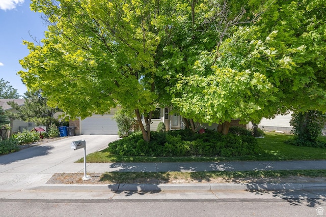345 E 2475 N, North Logan, UT 84341 - obstructed view of property featuring concrete driveway and a garage