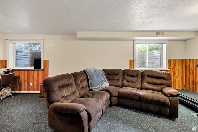 345 E 2475 N, North Logan, UT 84341 - living room with carpet, wood walls, a textured ceiling, and wainscoting