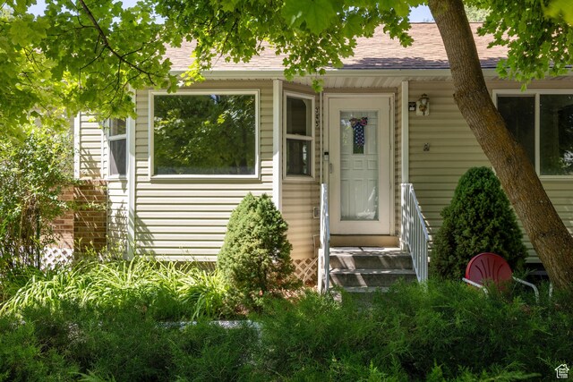 345 E 2475 N, North Logan, UT 84341 - doorway to property featuring roof with shingles