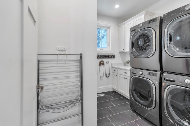 953 E 1000 N, American Fork, UT 84003 - washroom with cabinet space, washing machine and clothes dryer, stacked washer / dryer, and dark tile patterned flooring